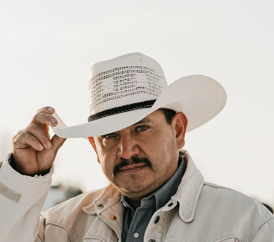 Man in white cowboy hat